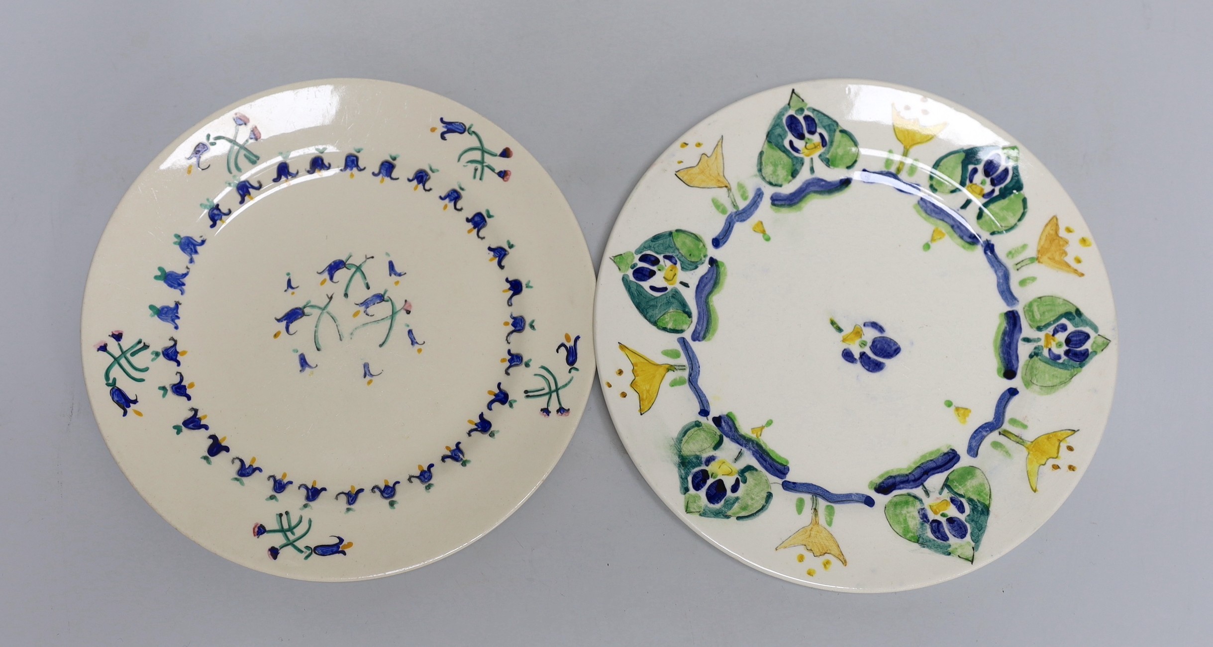 Jessie Marion King (1875-1949), four various floral design tea plates and three tea cups